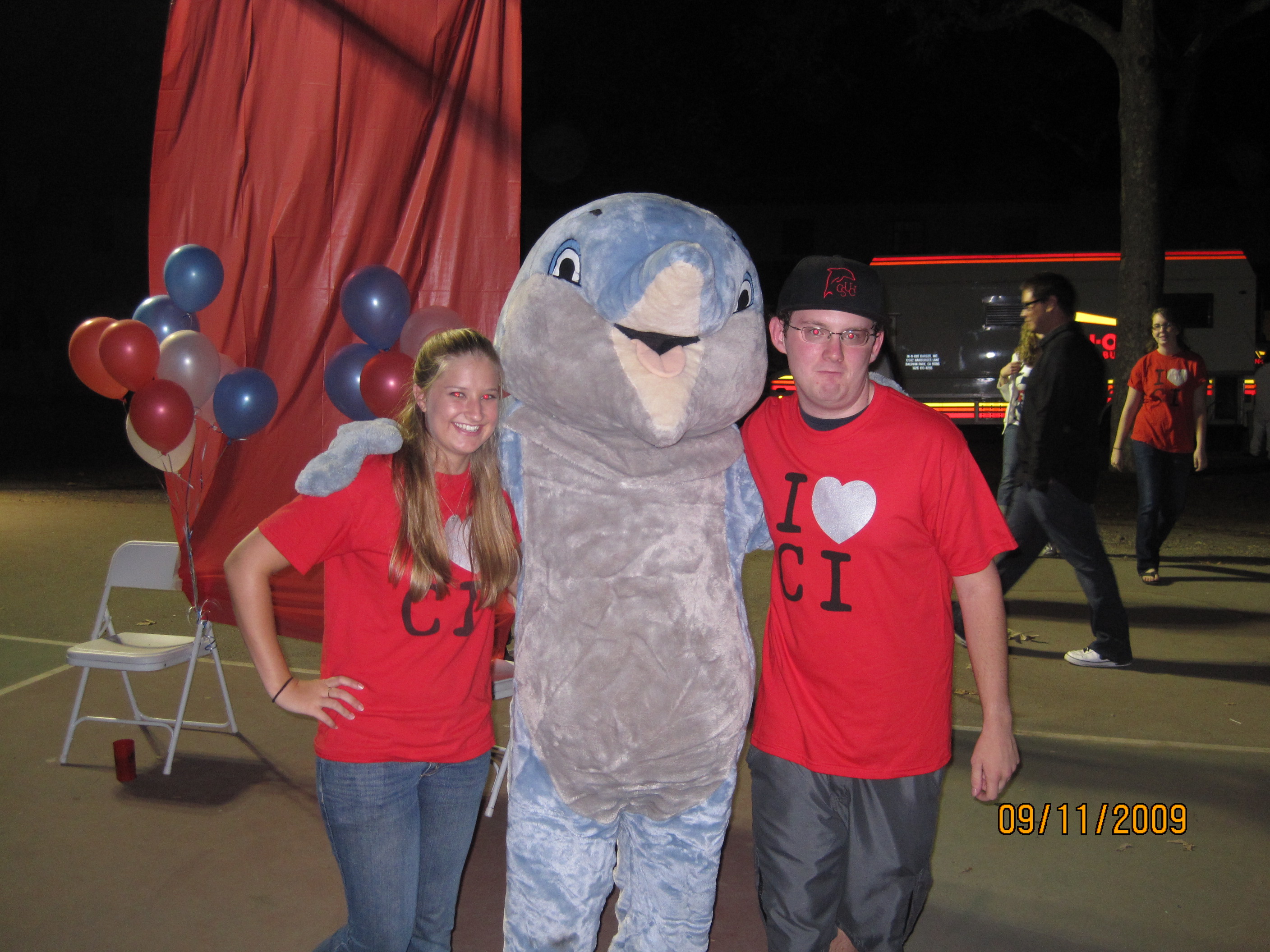 Alexander See and Christine Wamba with Dolphin Mascot